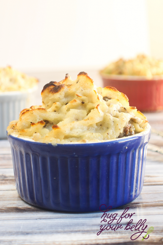 blue dish with shepherds pie, showing crispy potatoes