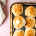 dinner rolls with pat of butter