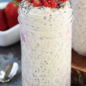 jar with overnight oats, topped with strawberries and chia seeds
