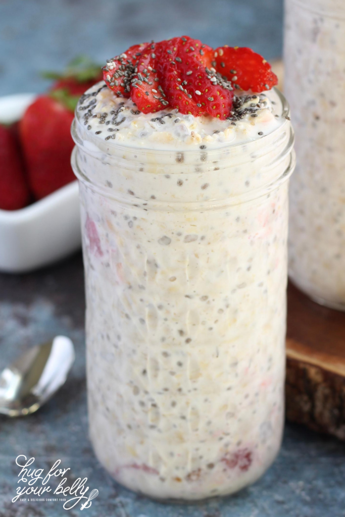 jar with overnight oats, topped with strawberries and chia seeds
