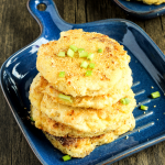 potato pancakes on blue plate sitting on wooden background